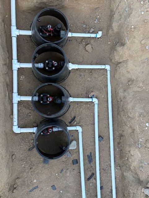 Commercial-grade irrigation manifold with Hunter valves and a reduced pressure backflow preventer